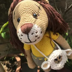 A close-up of Jireh's friendly face. I embroidered his smile and freckles to give him a gentle expression.