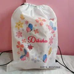 A custom drawstring bag with a cute butterfly and floral print, personalized with her name. Perfect for carrying her essentials.