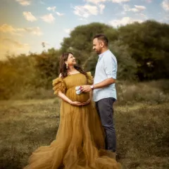 Golden hours, timeless memories. As the parents-to-be stood against this breathtaking outdoor backdrop, their love and anticipation told a story that needed no words.