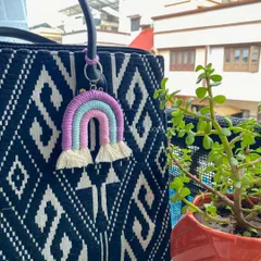 Add a little rainbow to your day! This pastel rainbow keychain is a sweet accessory for your bag and a great way to carry a little bit of handmade joy with you.