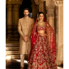A full look from the Shyamal & Bhumika campaign, showcasing both bridal and groomswear. We shot this in a heritage location, using the architectural details and soft lighting to create a regal and timeless portrait.
