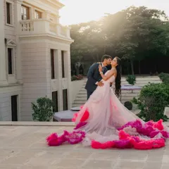 A fairytale moment against a stunning architectural backdrop. The flowing gown and the golden hour light came together to create a truly magical pre-wedding photograph.