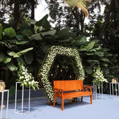 A close-up of a floral arch against our signature green wall. This setup is perfect as a photo booth or a backdrop for a small ceremony.