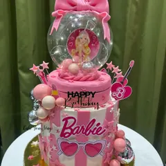 For the ultimate Barbie fan, I designed this two-tier glam cake. It’s all about the pink, the sparkle, and the fun details, including a light-up globe topper. This is the kind of showstopper I love creating for kids' birthdays.