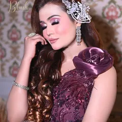 Another shot of this glamorous party look. The soft curls and sparkling hairpiece complete the look, showing the importance of coordinating hair and makeup.