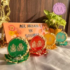 A lineup of my colorful Lakshmi Ganesh standees, available in green, red, yellow, and teal. Each one sits on a beautiful lotus base.