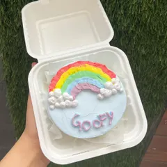A cheerful rainbow bento cake to brighten anyone's day. These small cakes are perfect for sending a little bit of happiness.