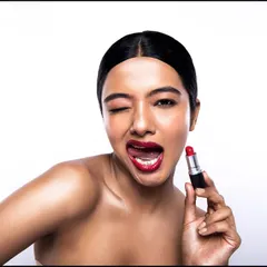 A fun, flirty beauty portrait. This kind of expressive shot is great for social media campaigns, creating an instant connection with the viewer.