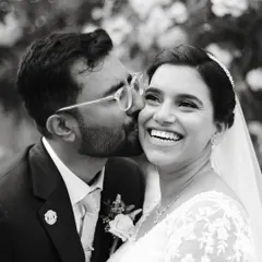 This is the kind of moment I live to capture. A candid black and white portrait of a groom kissing his bride's cheek, filled with pure, unscripted laughter. My goal in every couple session is to create a space where you can be yourselves, and I can document the genuine connection you share.