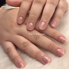 This is an acrylic overlay on natural nails, topped with a cat eye effect. An overlay adds strength to your own nails, helping them grow long and strong without breaking.