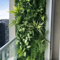 Even a small balcony can become a lush escape. We designed and installed this custom artificial vertical garden, creating a vibrant, maintenance-free wall of greenery that adds life and privacy to this urban apartment.
