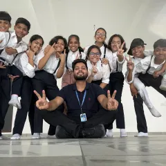 A fun, candid moment with my dance crew after a tough rehearsal. We are more than just a class, we are a family that supports and grows together.