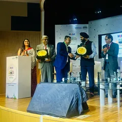 Facilitating an award presentation during the Make in India event. My role often includes guiding dignitaries through ceremonial proceedings with grace and precision.