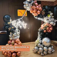A bachelorette setup with stars, balloons, and all the feels. This edgy and glamorous decor in black, silver, and rose gold was for a "Last Walk of Shame" themed party.