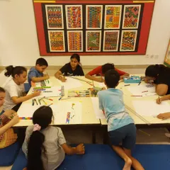 Serious drawing in progress! Here, my 8 to 15-year-old students are working on creating a 3D city, focusing on perspective and detailed line work.