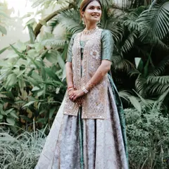 A full-length shot of her unique Mehendi outfit. The makeup is fresh and light, perfect for a daytime event, allowing her to feel comfortable and look stunning.