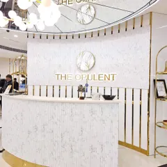 The first thing you see when you enter is our stunning reception desk. The combination of white marble, gold accents, and modern lighting sets the tone for the luxury experience that awaits.