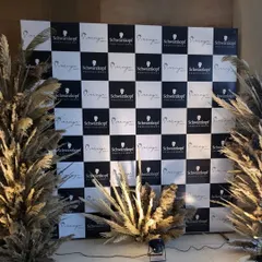 We create memorable photo opportunities that put your brand front and center. For this Schwarzkopf Professional launch event, we designed and installed a custom checkerboard backdrop, framed with stylish pampas grass for a modern, chic look.