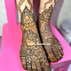A side angle of the floral foot mehendi, showing how the leafy vines elegantly climb up the ankle.
