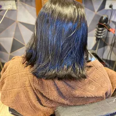 This is the "before" shot, showing the client's naturally straight hair before we began the permanent curling treatment.