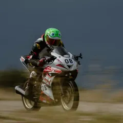A rider in a unique frog-themed helmet, showing that our community is full of personality. We're all serious about riding, but we have fun doing it.