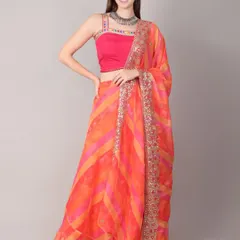 Celebrate the first day of Navratri in this auspicious orange and pink lehenga. The striped skirt has a beautiful flow, and the dupatta is bordered with intricate sequin work.