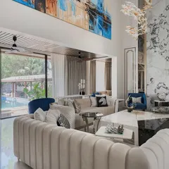 We designed this living area to open directly onto the pool deck, blurring the line between indoors and outdoors. The space is filled with natural light, and the layout uses symmetry and luxurious materials to create a warm, lived-in feel that is connected to its surroundings.