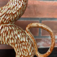 A close-up of the handle and carved texture on this double donut vase. The glaze breaks over the texture beautifully, highlighting every single mark.