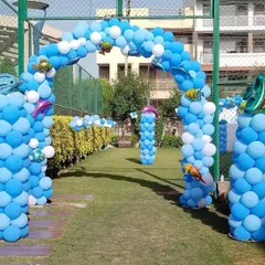 An impressive under-the-sea themed entrance walkway for Nikhil's birthday. We lined the path with multiple blue balloon arches and pillars, decorated with fish and dolphin foil balloons to create an underwater tunnel effect.