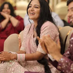 The bride's radiant smile during her engagement ceremony. The natural makeup application ensures she looks like herself, just enhanced, perfect for candid photography and interacting with guests.