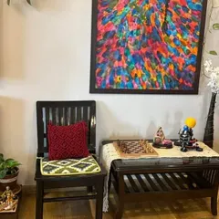 Even a single chair in a cozy corner can be transformed with a handmade macrame cushion cover. I love how this looks in my client's space.