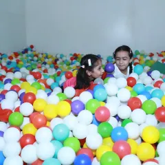 The absolute chaos and fun of a birthday party. I love diving right into the action, capturing the energy and laughter of kids at play. This shot from a ball pit is a perfect example of the candid, joyful moments I look for during event photography.