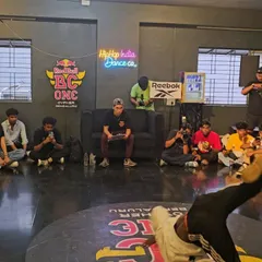 A b-boy mid-power move during the Red Bull BC One cypher at our studio. We regularly host high-profile events that connect our students to the global breaking scene.