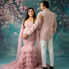 A beautiful portrait of an expecting couple. The way he looks at her is everything. This pink lace and tulle gown is one of the many options available in my client wardrobe.