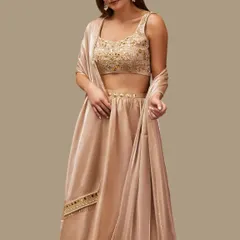 Another angle of the champagne gold lehenga, showing the flow of the silk skirt and the delicate embellished belt. This is custom couture that feels made for your soul.