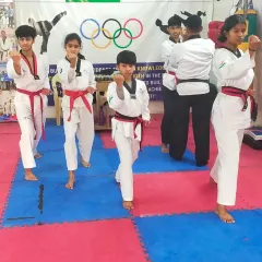 Our red belt students performing their Poomsae in unison during the black belt test. Synchronization and precision are key elements we look for.