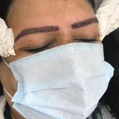 Here is the final result of our eyebrow microblading service. Notice the clean, natural-looking hair strokes that create a fuller, perfectly defined brow shape, eliminating any patchiness for a polished look.