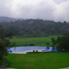I believe that recharging means finding peace in beautiful surroundings. This infinity pool overlooking the misty hills of Coorg is just one example of the premium, serene accommodations I arrange for corporate offsites.
