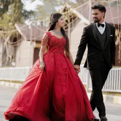 The grand walk as a newly married couple. This photo captures the elegance of their reception attire and the confident joy as they step into their future together.