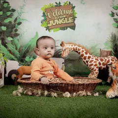 Our 'Welcome to the Jungle' set is filled with plush animal friends. This setup provides a safe and engaging environment for your child's safari adventure photoshoot.