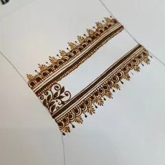 A close-up of a practice strip. I often work on small sections like this to perfect a particular border or filler pattern until the muscle memory is perfect.