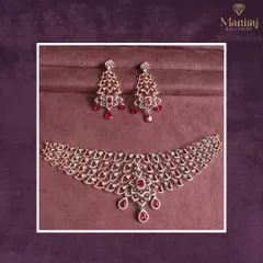 A masterpiece of elegance and grace. This stunning diamond necklace with cascading ruby drops is designed for moments that call for high drama and glamour.