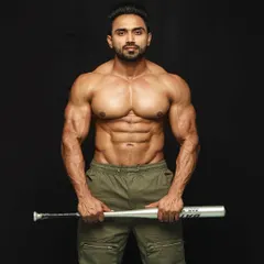 Holding the bat, ready for whatever comes next. Strength isn't just for the gym.