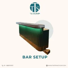 Elevate your entertaining space with a chic home bar. This design features a fluted glass front with green backlighting and a solid wood top, creating a stylish focal point for any social gathering.