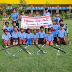The next generation of hockey players, holding the Olympic Day banner with pride. We organize these events to inspire our youngest athletes.