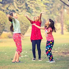 The pure, unscripted joy of childhood. I captured these three sisters mid-laugh as they played together in the park, creating a photo that is full of life and energy.