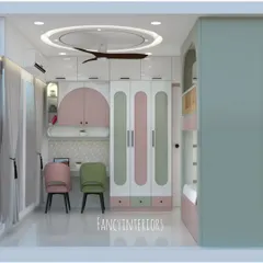 A 3D render of a spacious and playful kids' bedroom. This view highlights the large, custom-designed wardrobe with pink and green accents and a dual-station study desk.