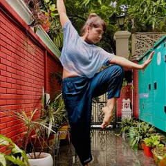 This pose, which I call "White Crane Energy," embodies fierce balance in the midst of chaos. It is a moment of finding strength in softness and stillness in motion, a perfect reset for the mind and body.