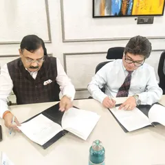 A close-up of the Memorandum of Understanding (MoU) being signed. This formalizes our strategic alliance to provide a diverse array of short-term and long-term diploma programs.