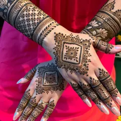 Another angle of the square mandala design, showing how the pattern extends to the fingers. The arms feature a mix of lotus motifs and jaal work for a complete look.